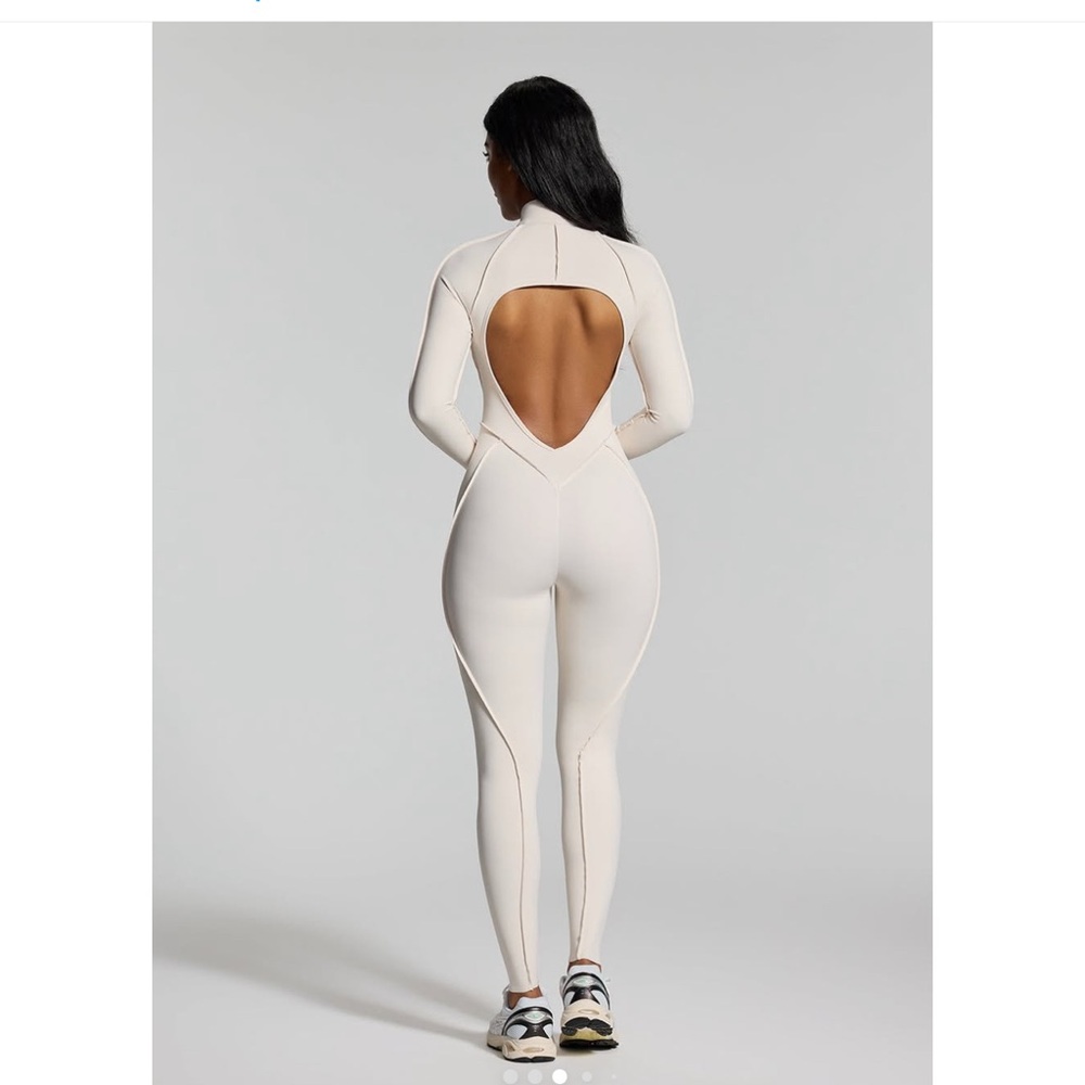 White full-body jumpsuit with cozy plush fabric and form-fitting silhouette